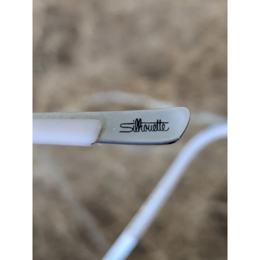 Silhouette Eyeglasses 4476 40 6053 52[]17 135 5416 Titan Creme Rimless Austria